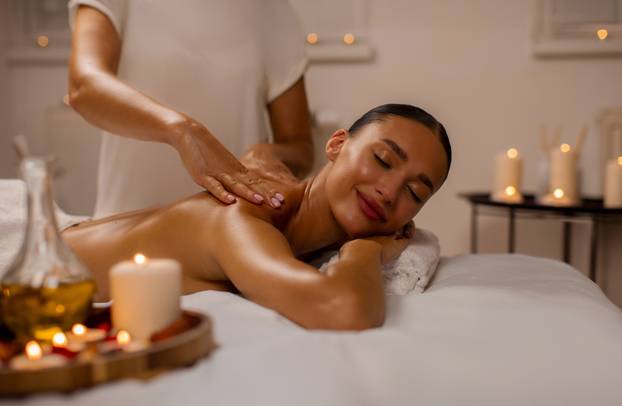 Young,Relaxed,Lady,Enjoy,Body,Massage,Lying,On,Table,At