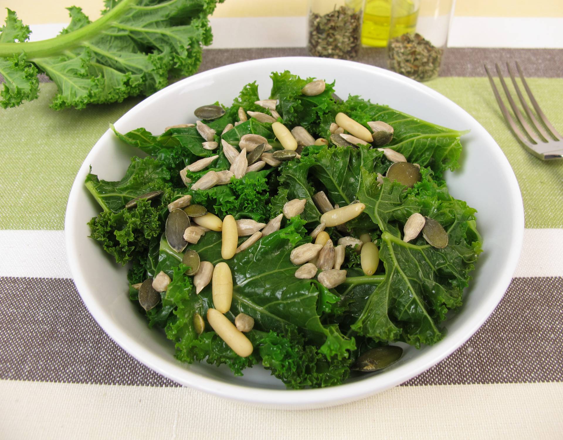 Kale salad with sunflower seeds, pine nuts, pumpkin seeds