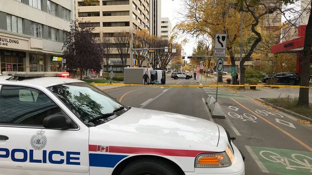 Edmonton Police investigate at the scene where a man hit pedestrians then flipped the U-Haul truck in Edmonton