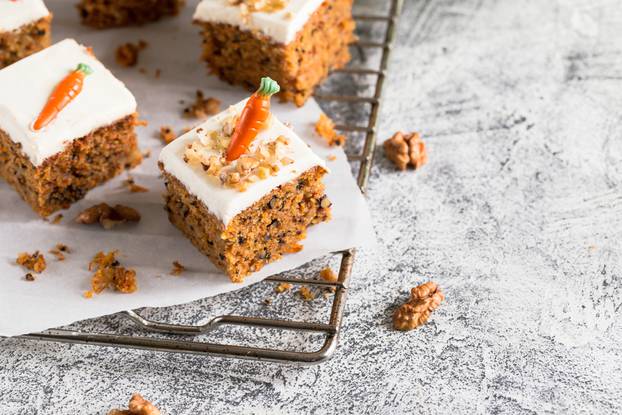 Pieces,Of,Carrot,Cake,With,Walnuts,With,Icing,Cream,On