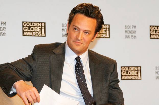 FILE PHOTO: Actor Matthew Perry waits to announce nominations at Golden Globes news conference in Beverly Hills