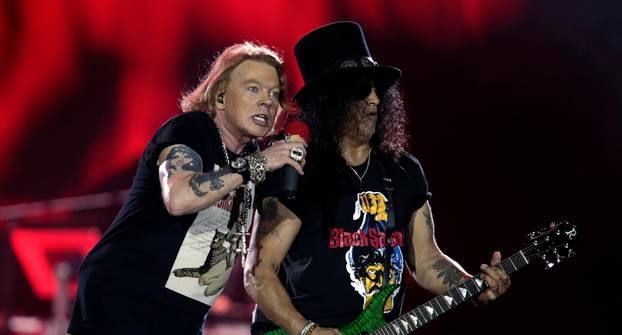 Axl Rose and Slash, lead singer and lead guitarist of U.S. rock band Guns N' Roses, perform during their "Not in This Lifetime... Tour" at the du Arena in Abu Dhabi