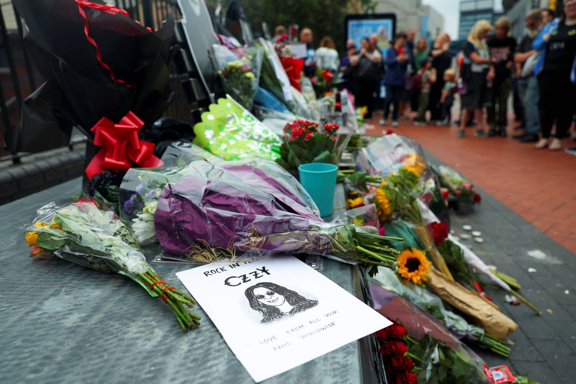 Fans pay tribute following the death of Ozzy Osbourne, in Birmingham