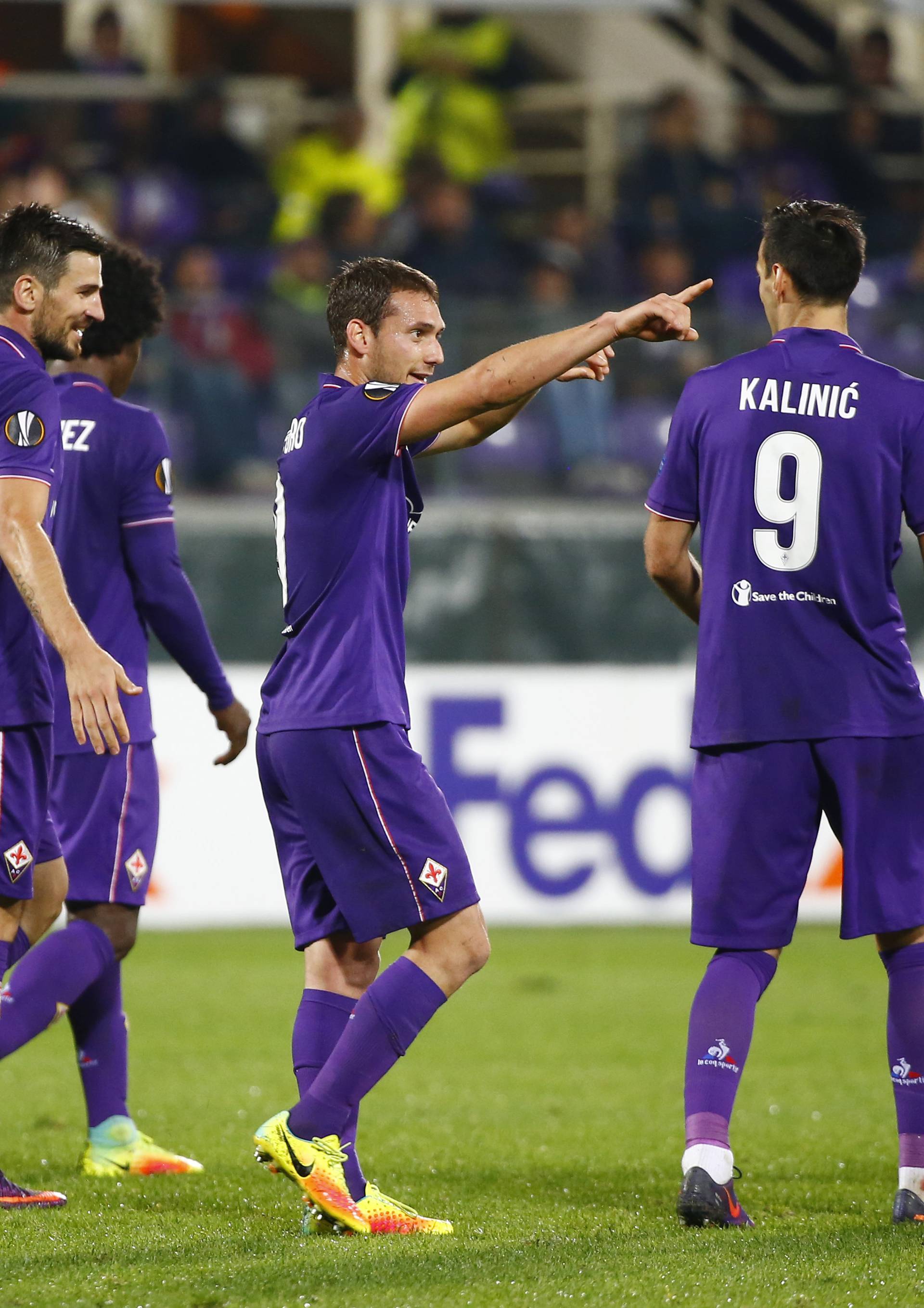 Fiorentina's Sebastian Cristoforo celebrates scoring their third goal with teammates