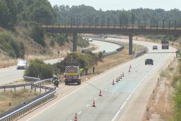 Police and cleaning services work at the crash site where Portuguese forward Diogo Jota died in Spain