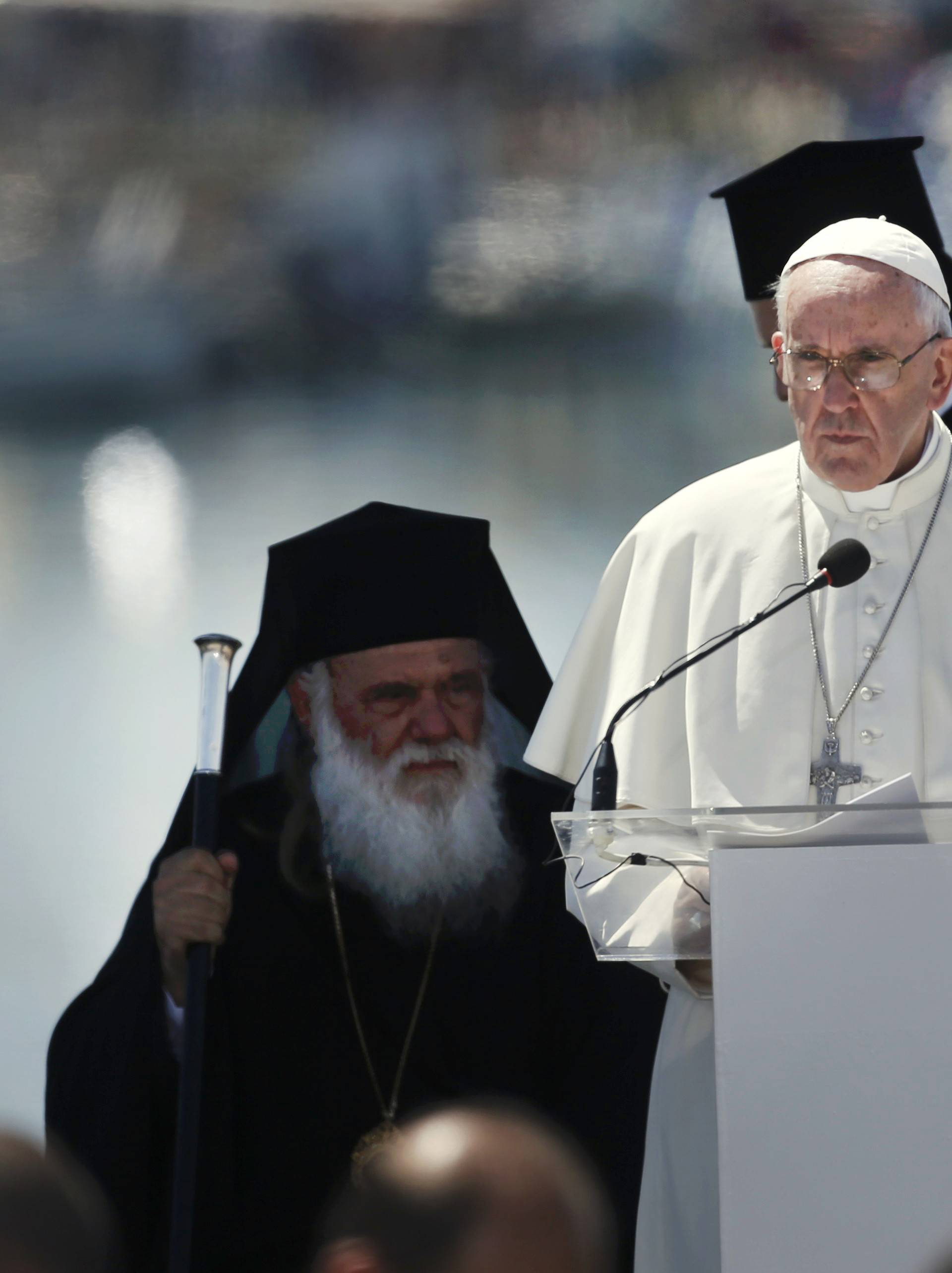 Pope Francis delivers his address at the port of Lesbos during his visit the Greek Island of Lesbos