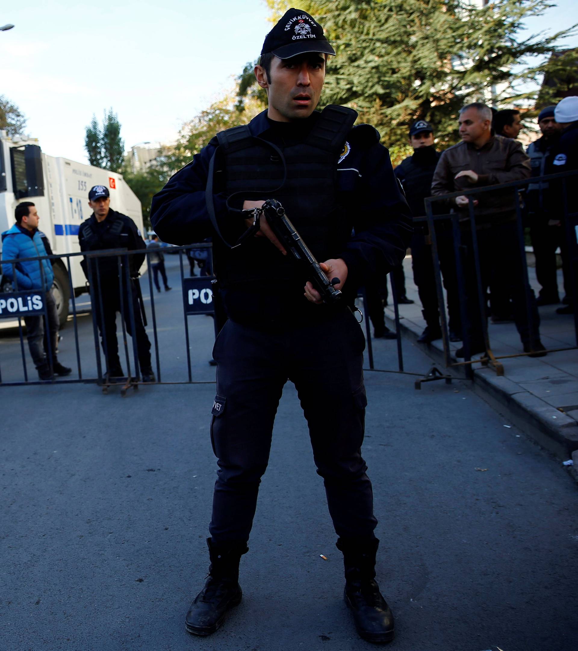 Riot police stand guard near the pro-Kurdish HDP headquarters in Ankara