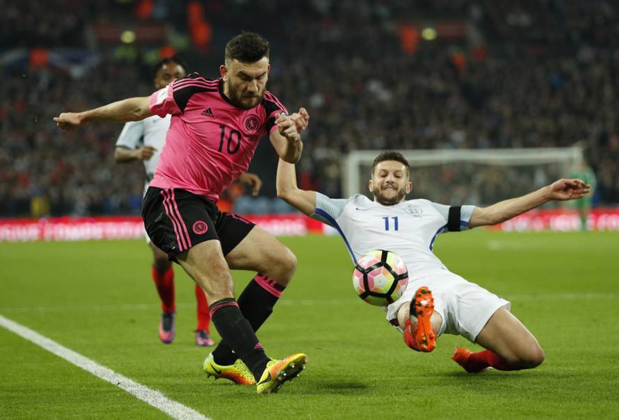 Scotland's Robert Snodgrass in action with England's Adam Lallana
