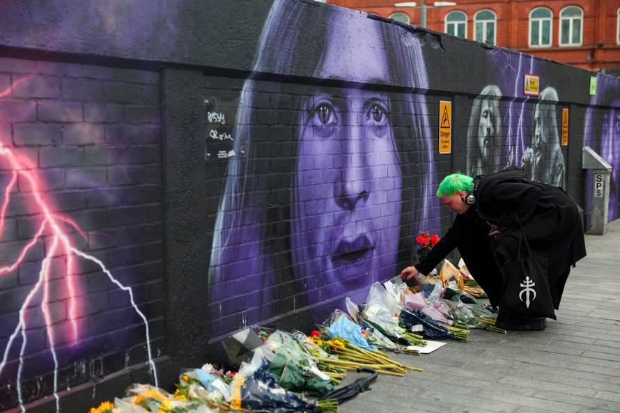 Fans pay tribute following the death of Ozzy Osbourne, in Birmingham