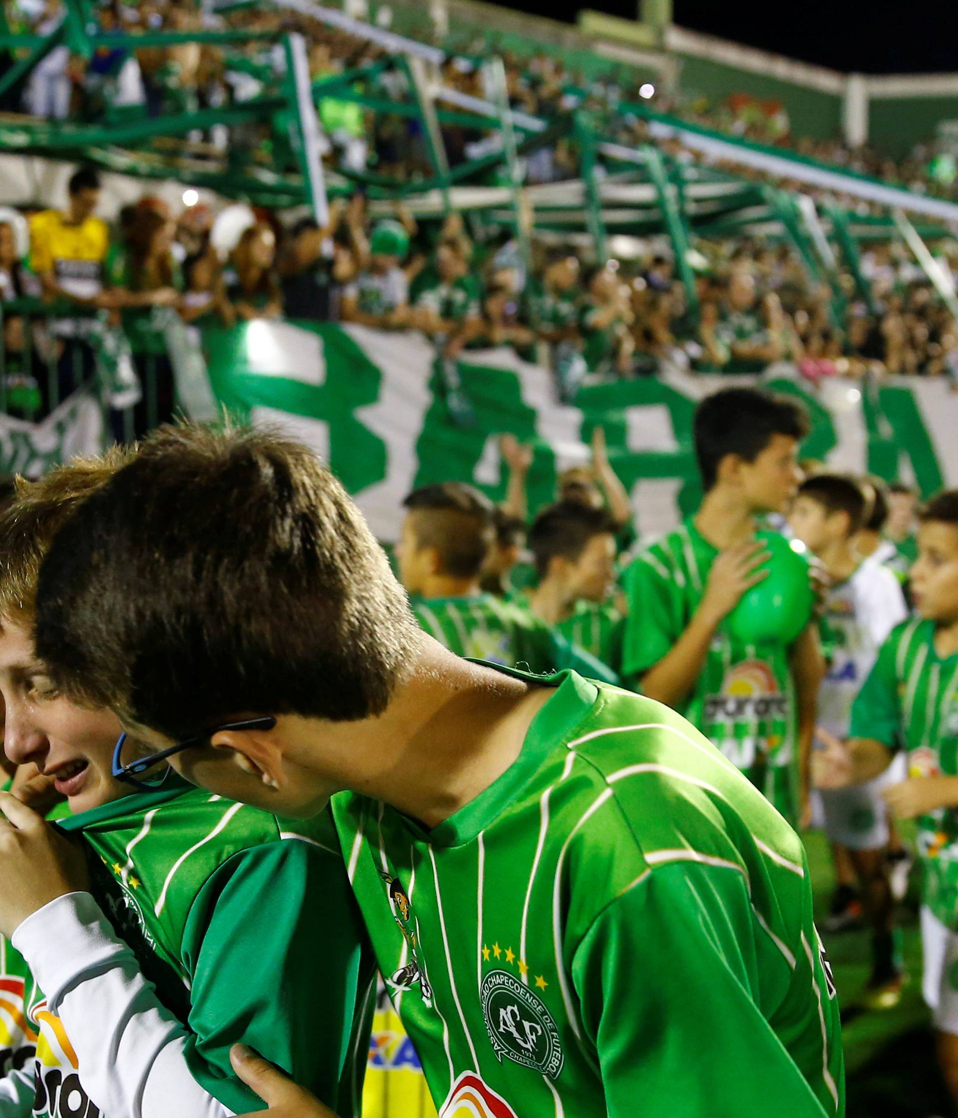 Youth players of Chapecoense soccer club pay tribute to Chapecoense's players at the Arena Conda stadium in Chapeco