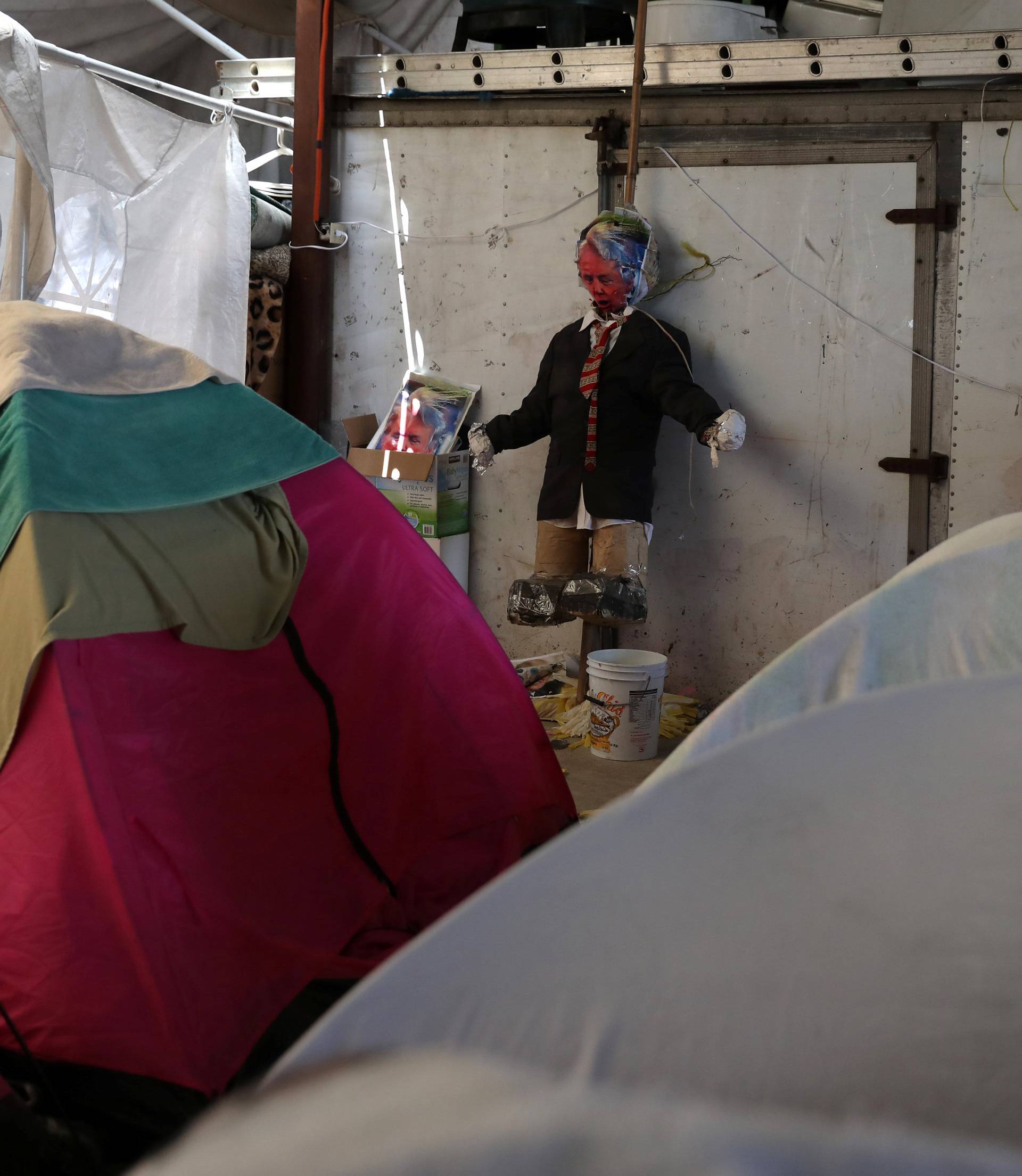 A puppet mocking U.S. President Donald Trump is seen at a migrant shelter in Tijuana