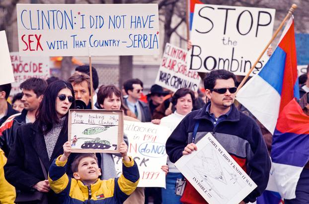 Serbs Yugoslavia bombing Serbia Serbian Kosovo NATO protest protesters demonstration demonstrators rally war military intervention US USA Washington DC White House America outdoors looks away politics portrait day flags signs horizontal