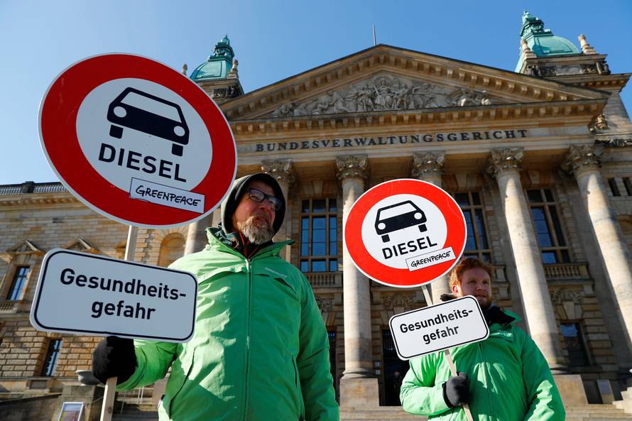 Greenpeace environmental activists protest in front of Germany's Federal Administrative Court in Leipzig