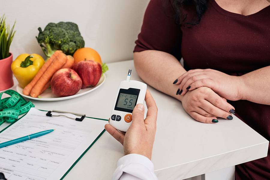 Measuring Blood Sugar. Nutritionist Using Glucometer Tests Overw