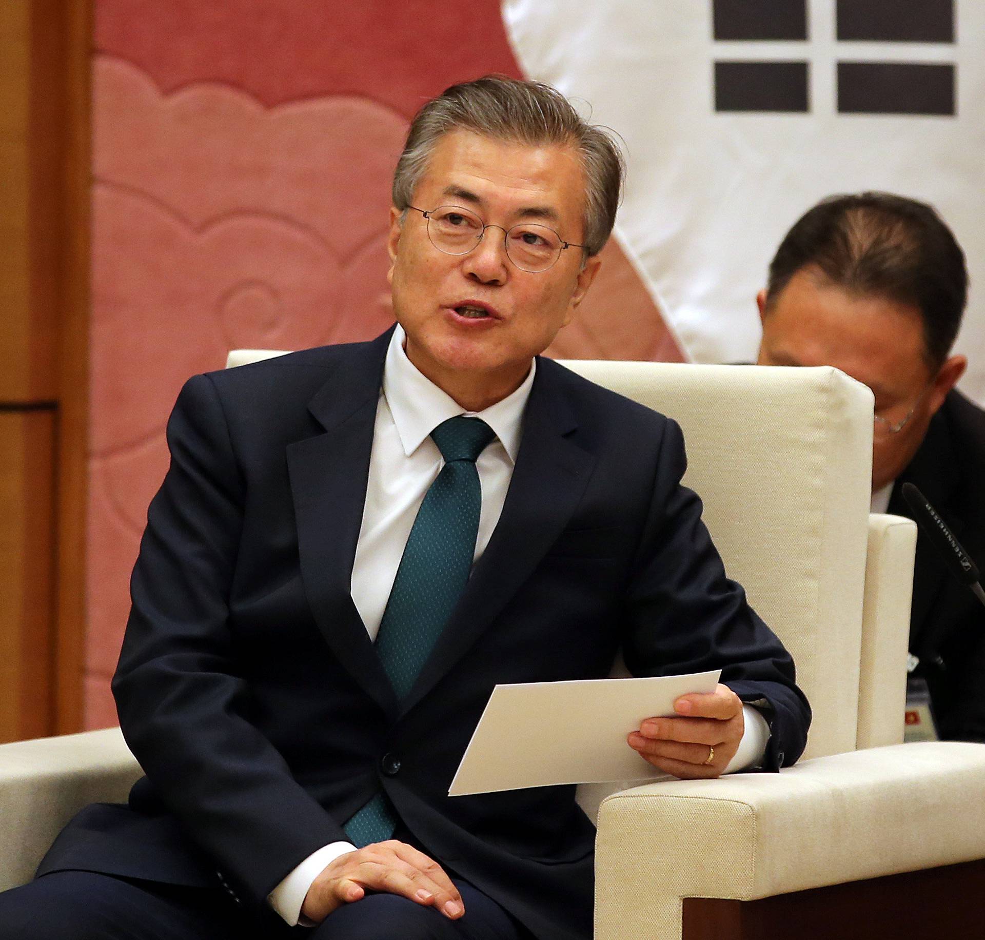 South Korean President Moon Jae-in talks to Vietnamese Chairwoman of the National Assembly Nguyen Thi Kim Ngan at the National Assembly in Hanoi