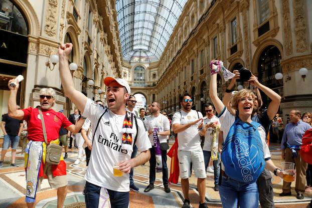 Real Madrid fans shout slogans before the Champions League Final between Real Madrid and Atletico Madrid in Milan