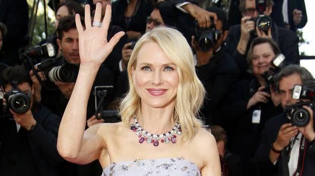 Actress Naomi Watts poses on the red carpet as she arrives for the opening ceremony and the screening of the film "Cafe Society" out of competition during the 69th Cannes Film Festival in Cannes