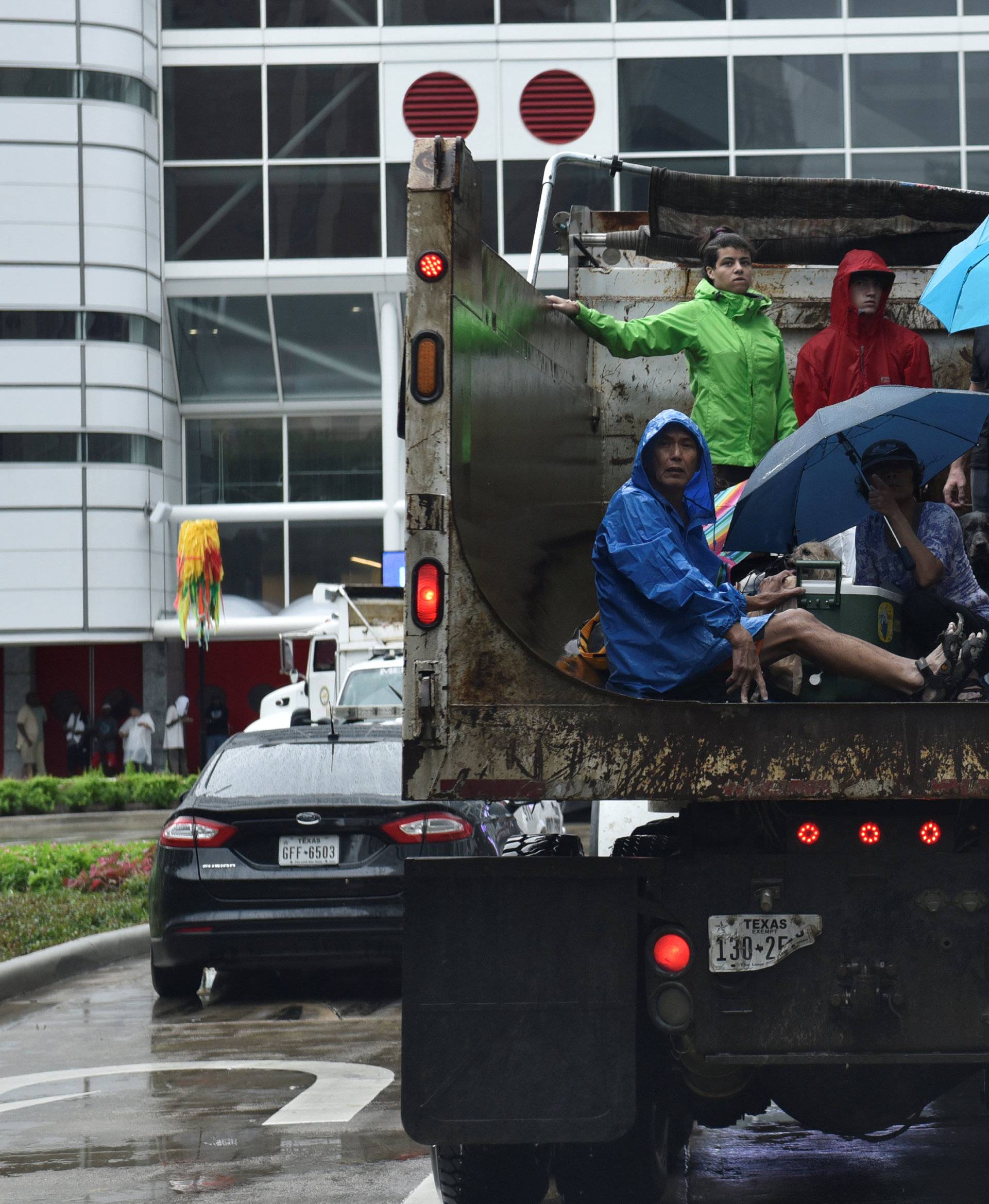 Evacuees are transported to the George R. Brown Convention Center after Hurricane Harvey inundated the Texas Gulf coast with rain causing widespread flooding