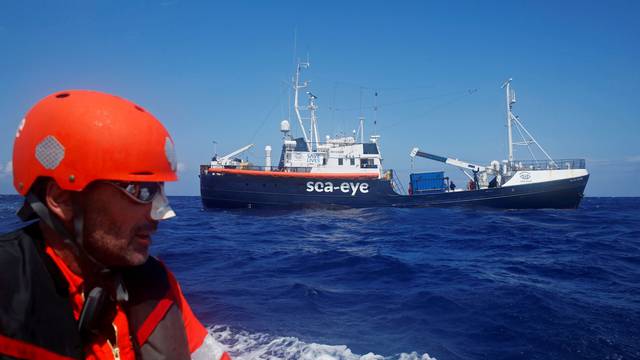 FILE PHOTO: Crew member of the German NGO Sea-Eye migrant rescue ship 'Alan Kurdi' takes part in a training exercise while on their way to the search and rescue zone off the North African coast, in the western Mediterranean Sea