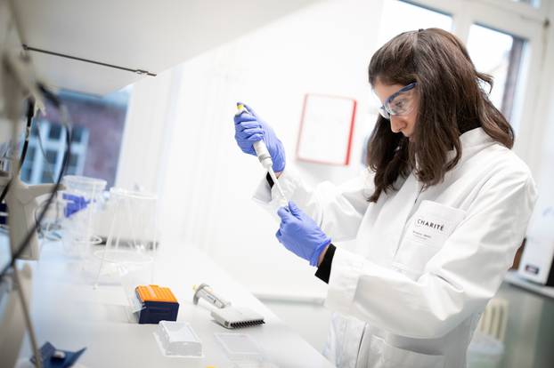 Charite hospital employees prepare a test for new coronavirus in Berlin