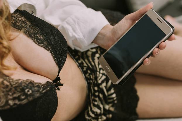 woman or girl with sexy clothes and mobile phone