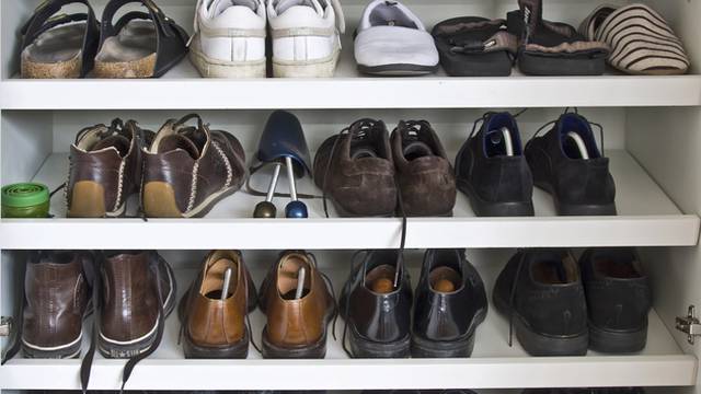 May shoes on shelves in a closet