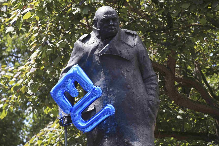 An EU balloon is tied to the Winston Churchill statue in Parliament Square during a 'March for Europe' demonstration against Britain's decision to leave the European Union, central London