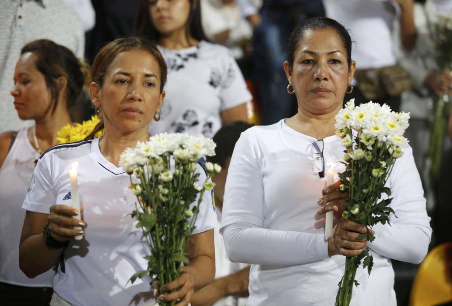 Fans of Atletico Nacional soccer club pay tribute to the players of Brazilian club Chapecoense killed in the recent airplane crash in Medellin