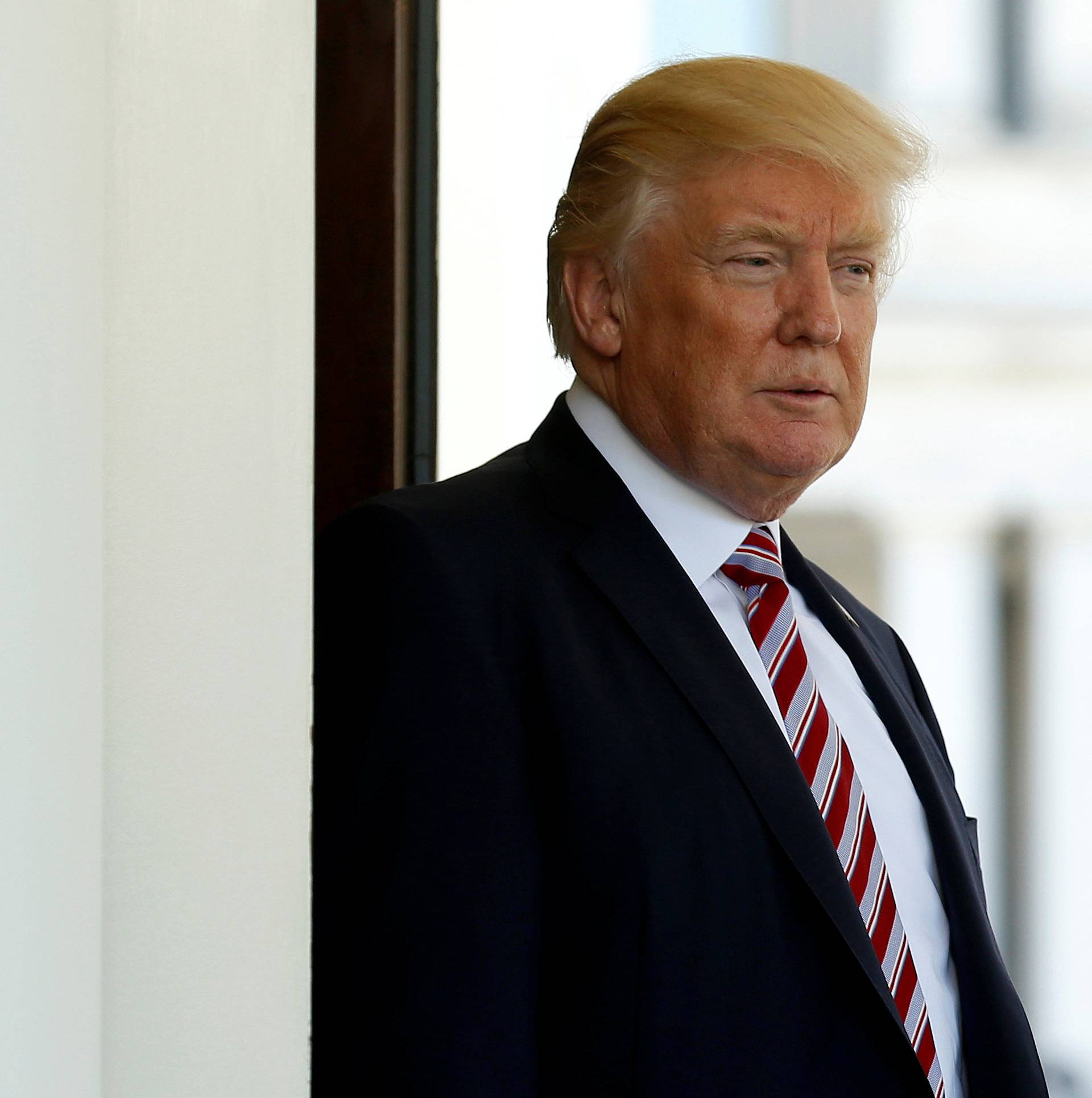 U.S President Donald Trump watches as Turkey's President Recep Tayyip Erdogan departs at the entrance to the West Wing of the White House in Washington