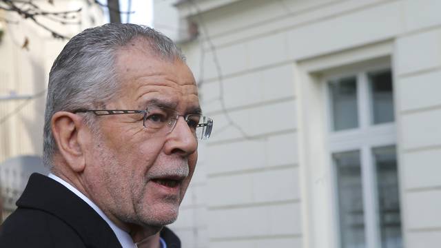 Austrian presidential candidate Van der Bellen, who is supported by the Greens, arrives in front of a polling station to cast his vote in Vienna