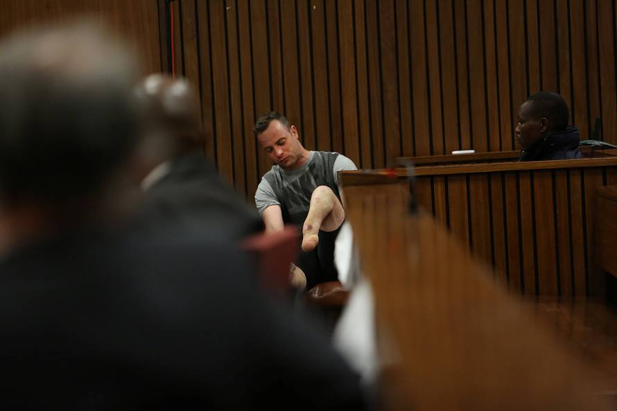 Paralympic gold medalist Oscar Pistorius sits in the dock during the third day of his resentencing hearing for the 2013 murder of his girlfriend Reeva Steenkamp