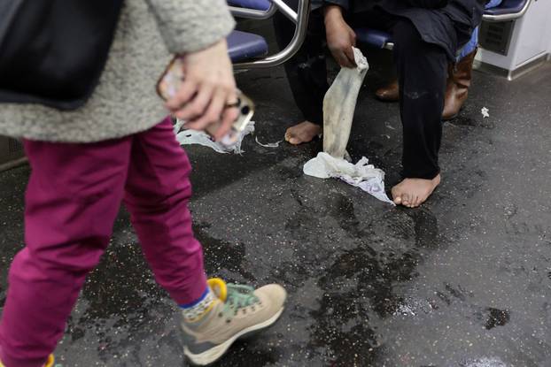 Commuters make their way though snow and ice in the aftermath of a winter storm in Washington