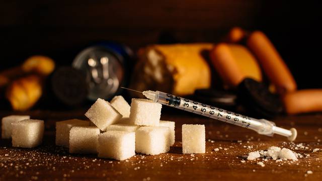 Disease - diabetes. Sugar, syringe for injection, harmful food 