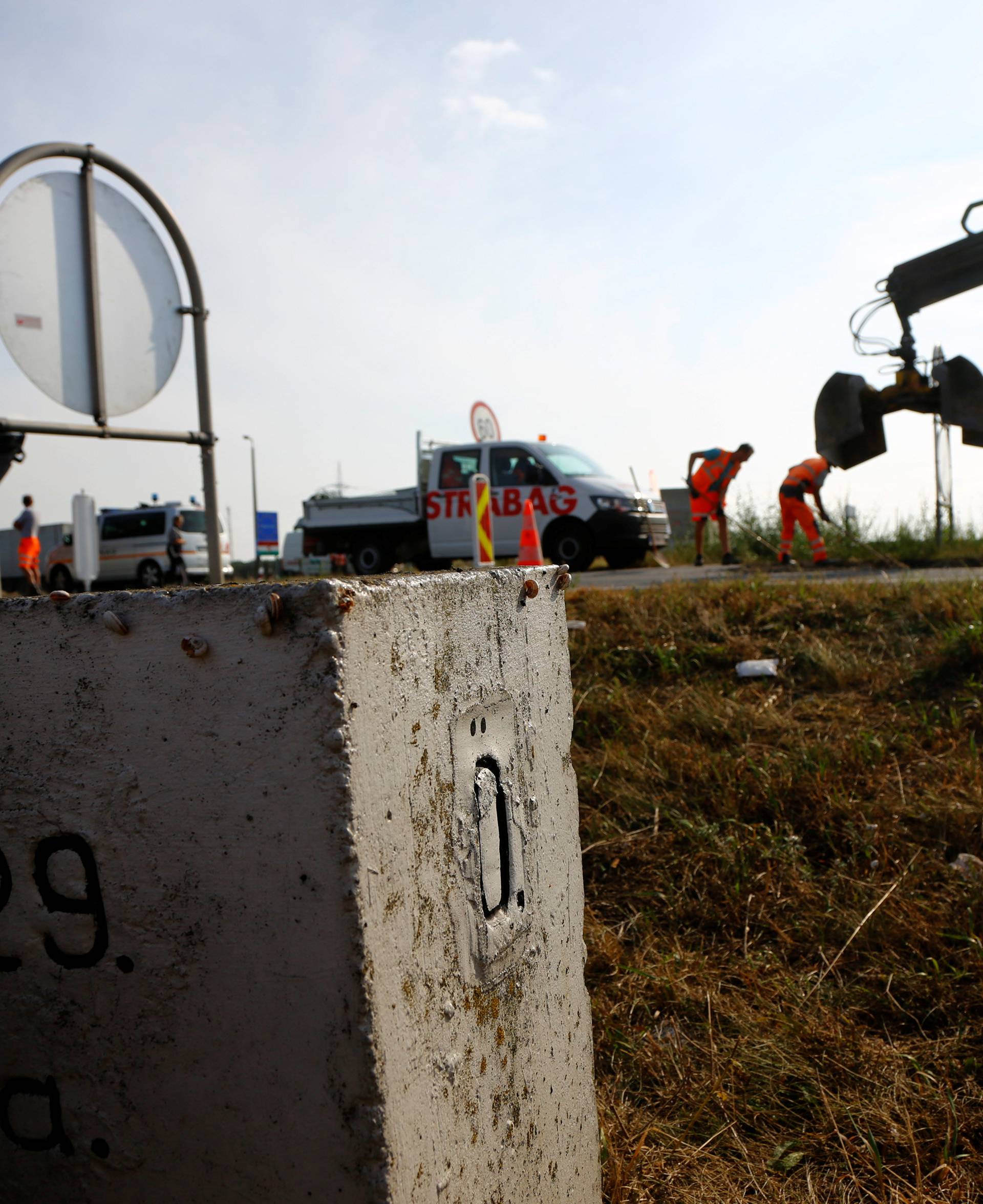 Construction workers are seen at the Austrian-Hungarian border near Nickelsdorf