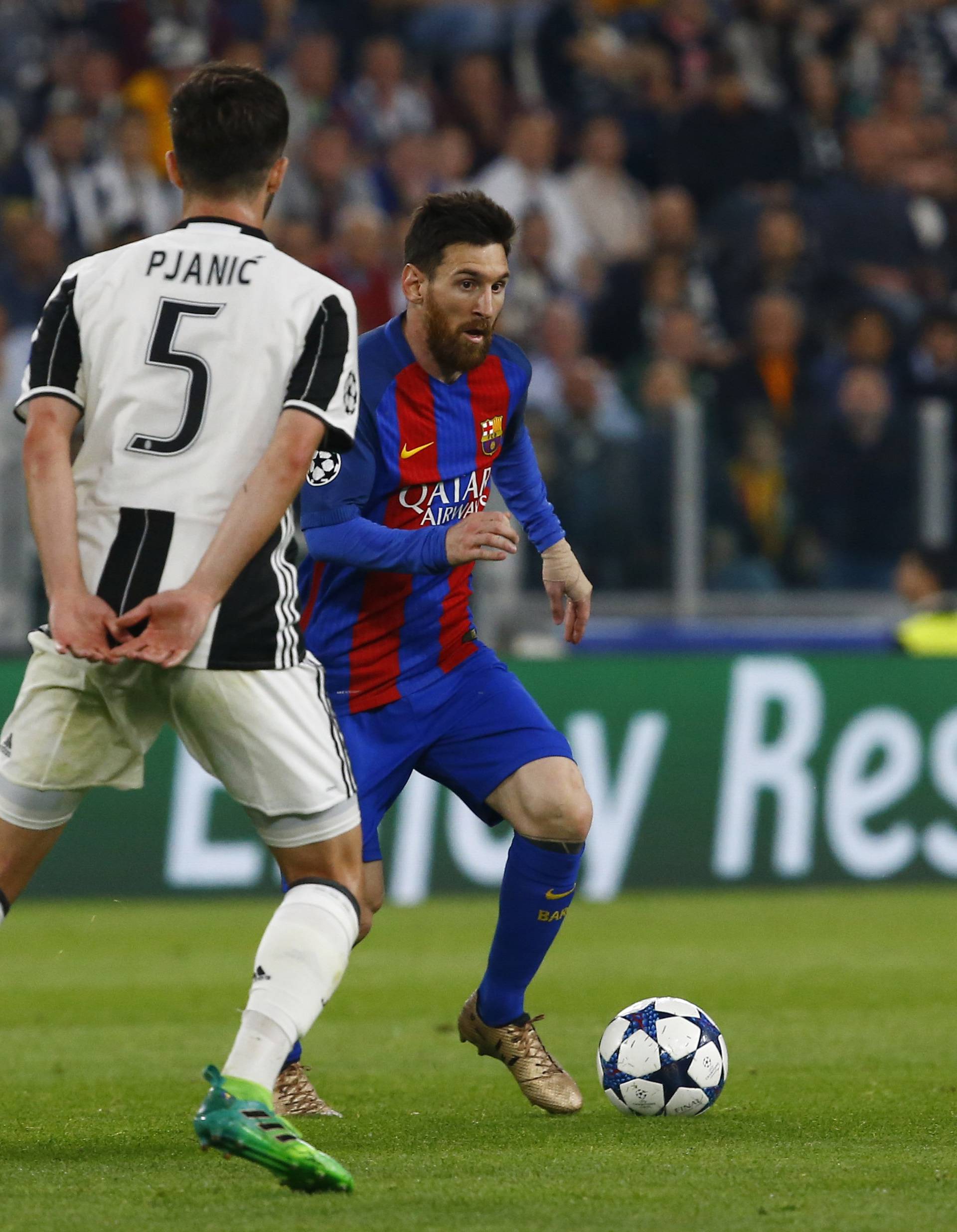 Barcelona's Lionel Messi in action with Juventus' Miralem Pjanic and Sami Khedira