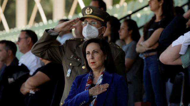 Spanish Defence Minister Robles stands at attention during a military anthem in Ronda