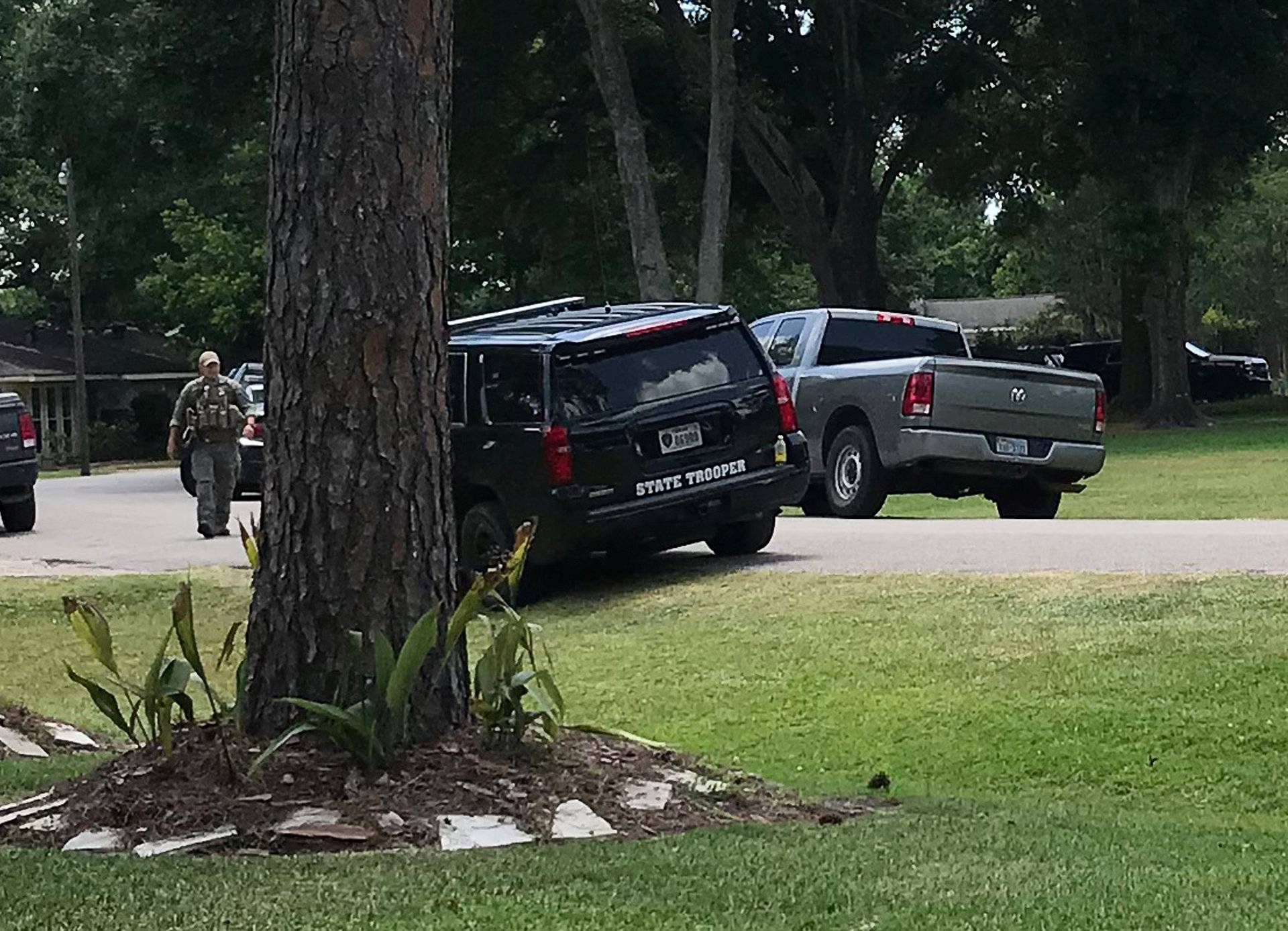 Police vehicles line the blocked-off street where the home of Dimitrios Pagourtzis, the suspect in the Santa Fe High School shooting, is located in Alvin, Texas