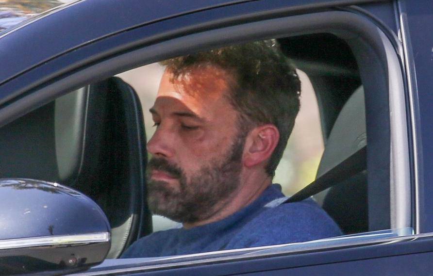 *EXCLUSIVE* Ben Affleck looks busy while driving as he picks up his son Samuel in Santa Monica