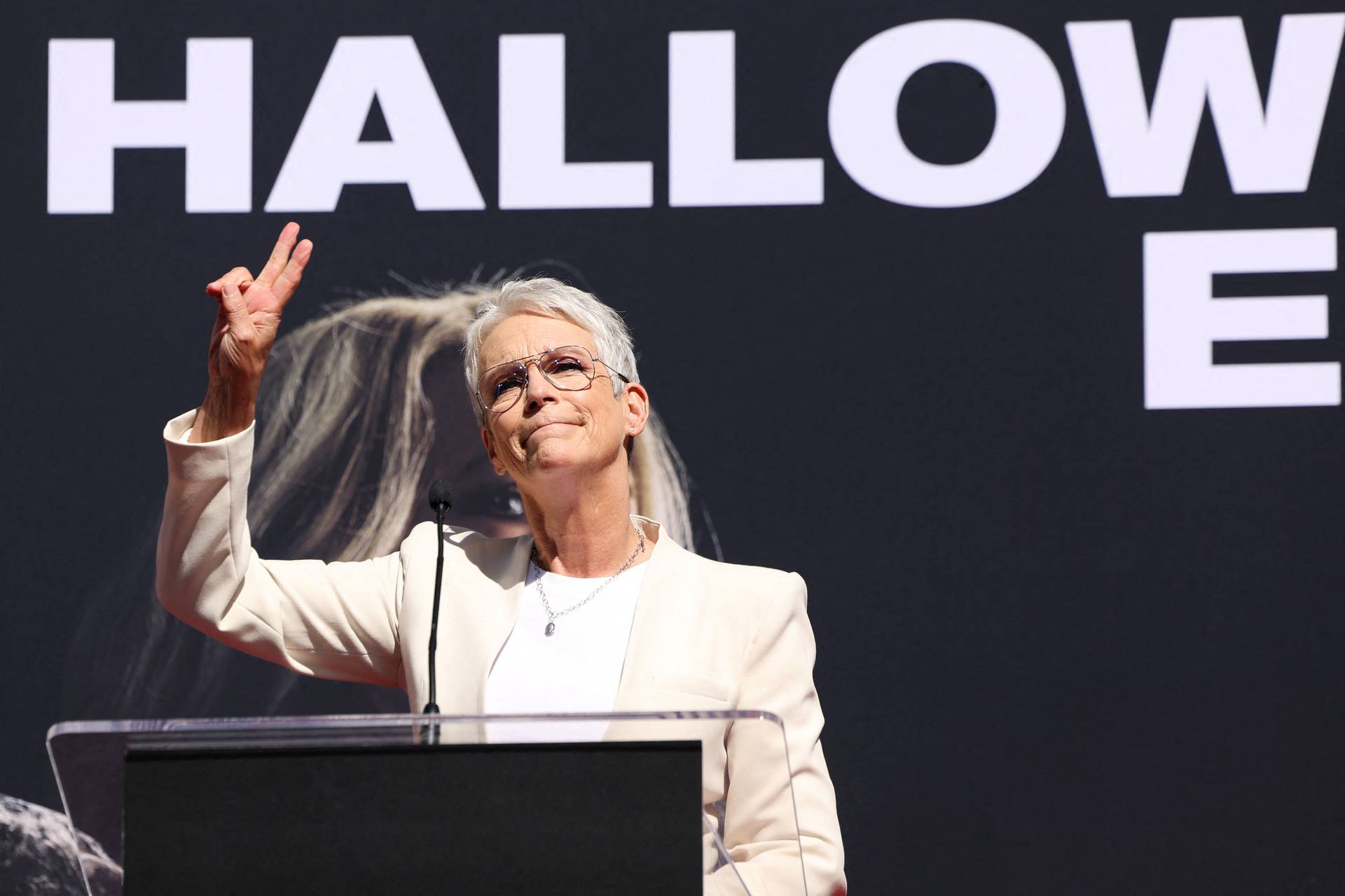 Actor Jamie Lee Curtis places her handprints in cement at the forecourt of the TCL Chinese theatre in Los Angeles