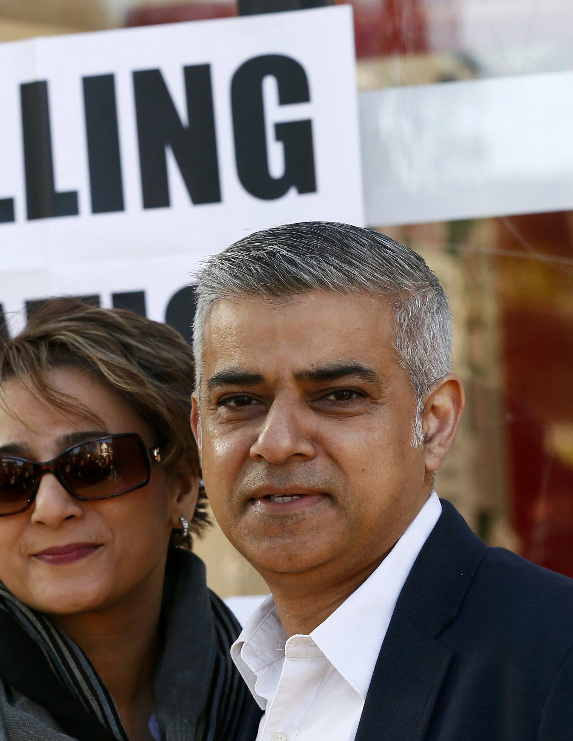 Khan,Britain's Labour Party candidate for Mayor of London and his wife Saadiya pose for photographers after casting their votes for the London mayoral elections