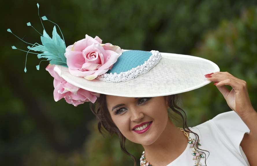 Britain Horse Racing Ladies Day Racegoer wears hat