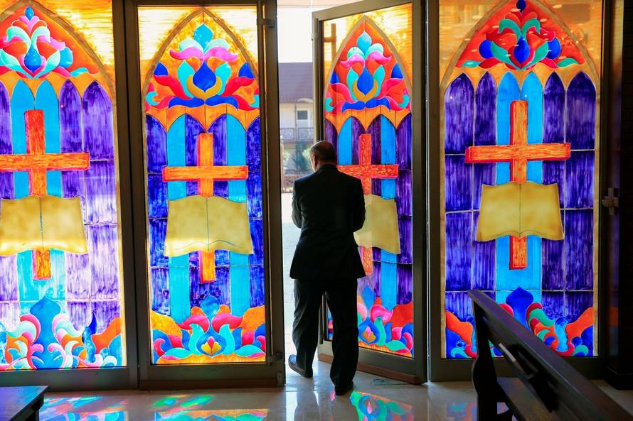 Thanoun Yahya, a 59 year-old an Iraqi Christian from the city of Mosul walks at Al-Bishara church in Mosul