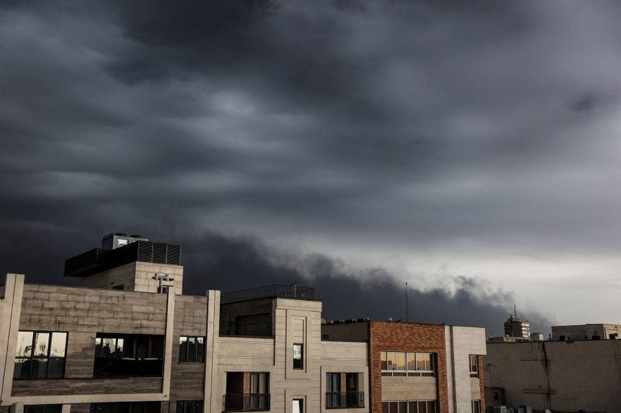 Smoke continues to rise after a reported strike on fuel tanks in an oil refinery, amid the U.S.-Israeli conflict with Iran, in Tehran
