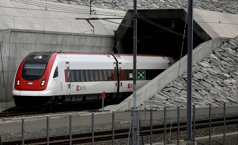 A passenger train of Swiss railway operator SBB leaves the NEAT Gotthard Base Tunnel near Erstfeld