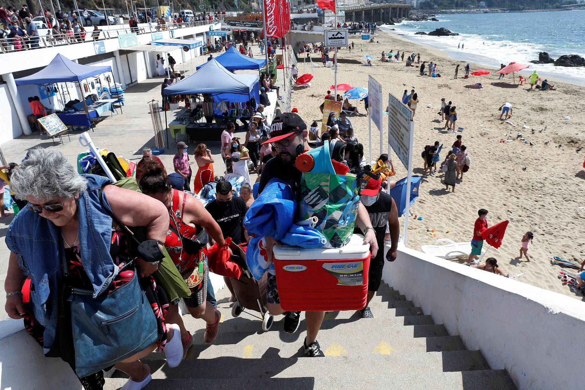 People evacuate the coastline in Chile after a tsunami preventive advisory generated by local authorities, in Vina del Mar