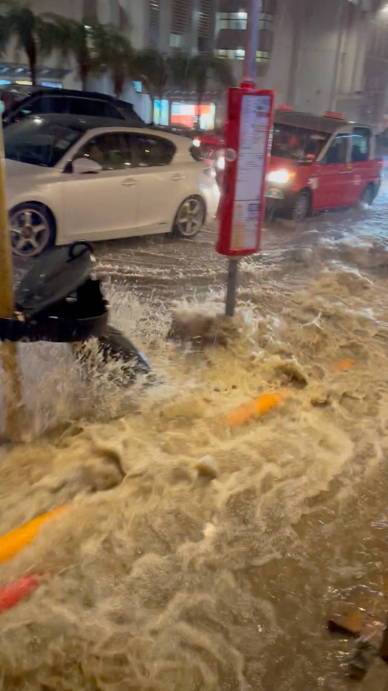 A view of a flooded road after heavy rains, in Hong Kong