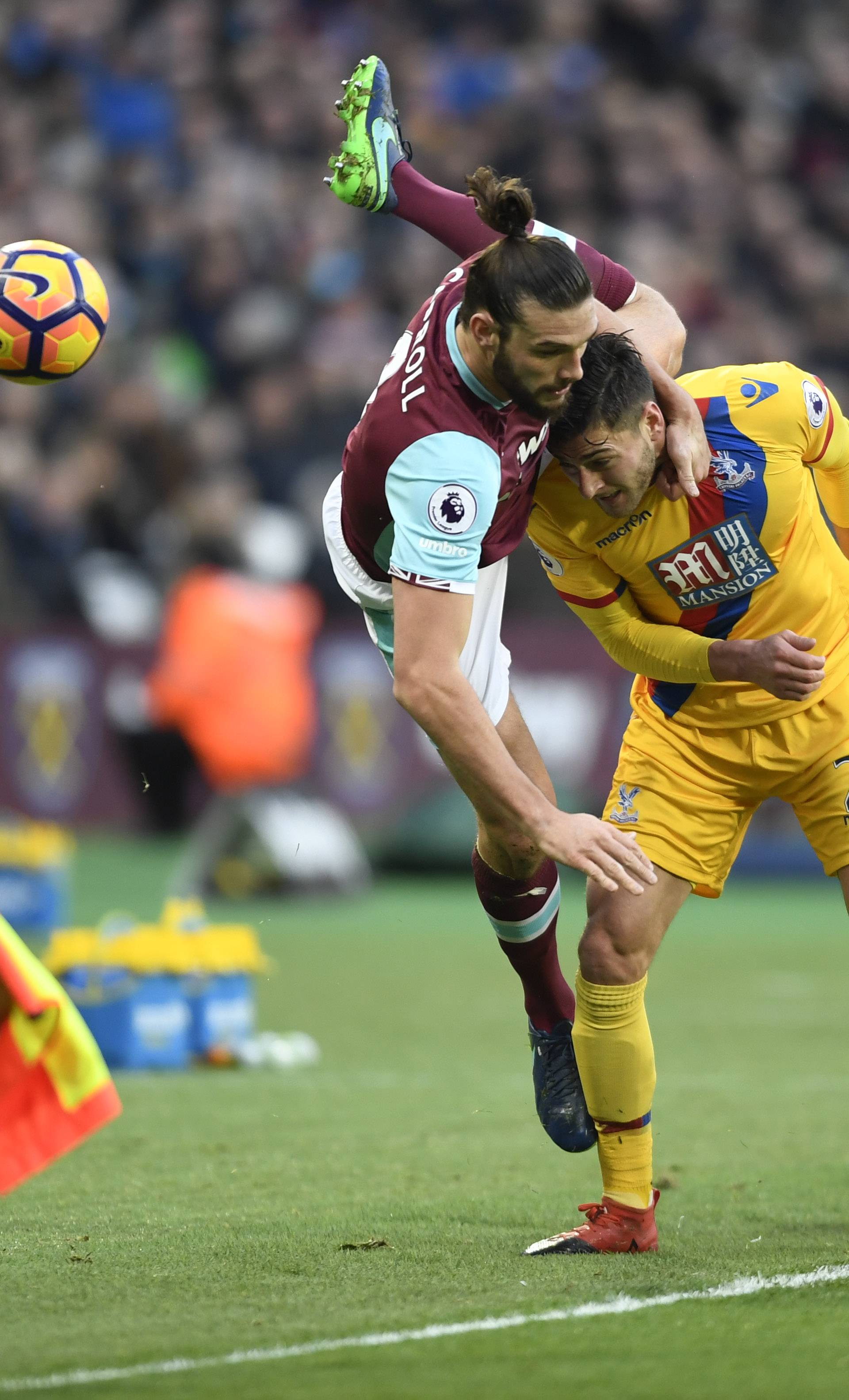 West Ham United's Andy Carroll in action with Crystal Palace's Joel Ward