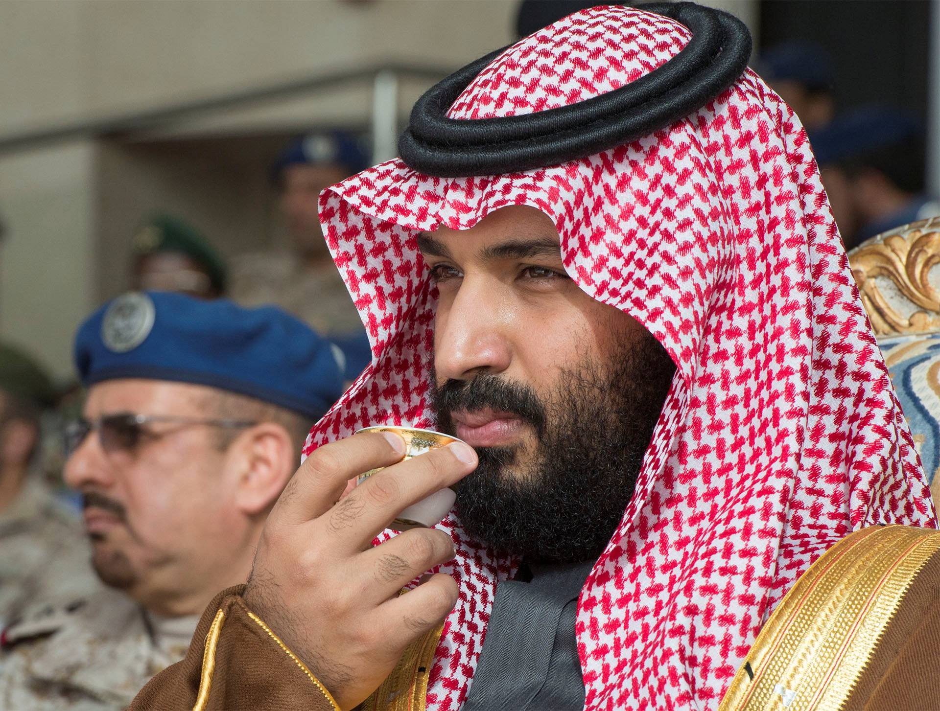 Saudi Arabia's Crown Prince Mohammed bin Salman drinks coffee during the graduation ceremony of the 93rd batch of the cadets of King Faisal Air Academy, in Riyadh