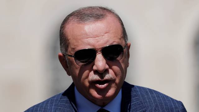 FILE PHOTO: Turkish President Tayyip Erdogan talks to media after attending Friday prayers at Hagia Sophia Grand Mosque in Istanbul