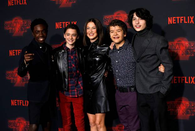 Cast members McLaughlin, Schnapp, Brown, Matarazzo and Wolfhard pose at the premiere for the second season of the television series "Stranger Things" in Los Angeles